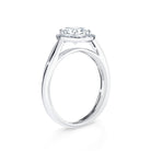 Anetta - Micheli Jewellery, floating setting on round brilliant cut diamond engagement ring side profile. swept up shoulders on engagement ring. diamond halo engagement ring side profile. white gold diamond engagement ring on the side.