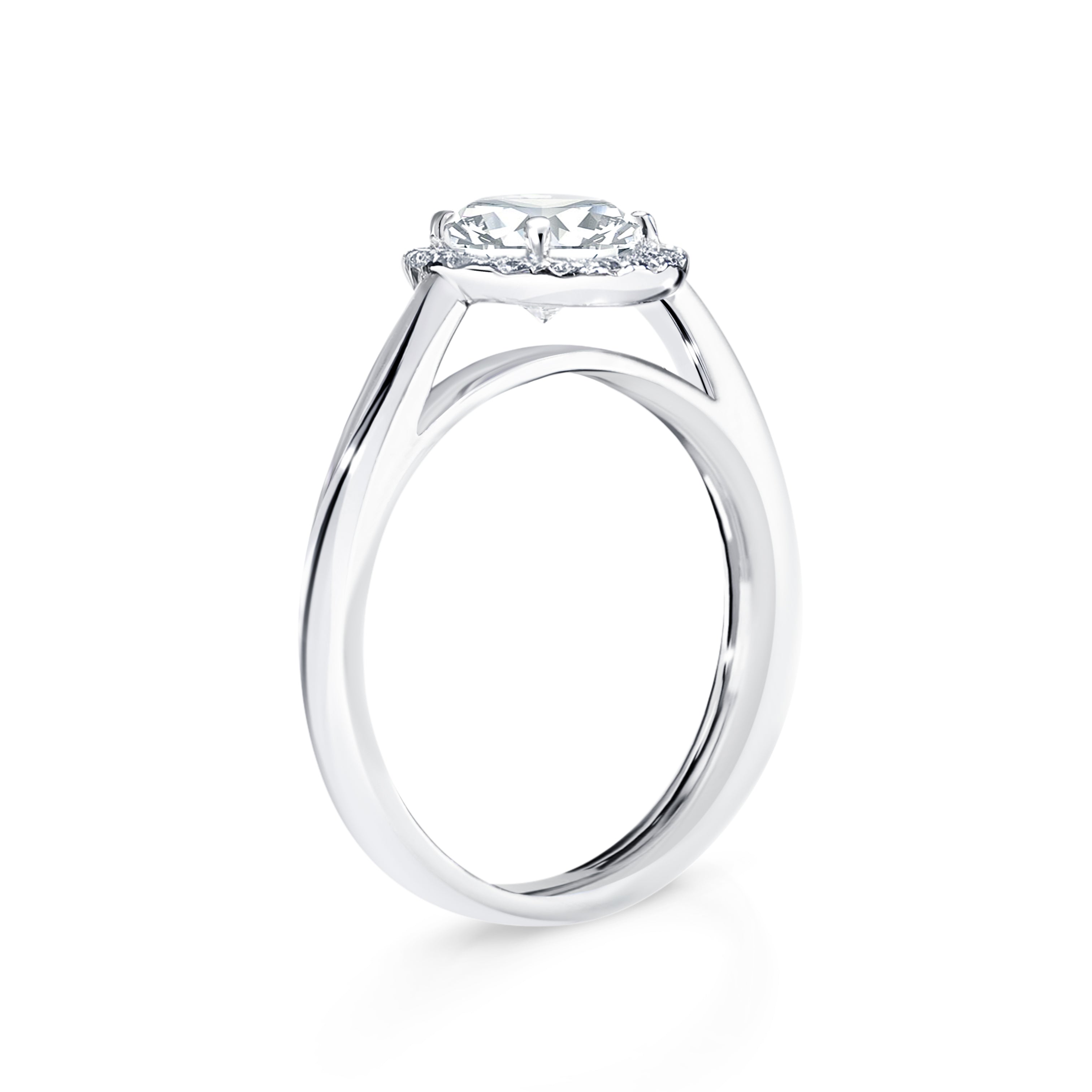 Anetta - Micheli Jewellery, floating setting on round brilliant cut diamond engagement ring side profile. swept up shoulders on engagement ring. diamond halo engagement ring side profile. white gold diamond engagement ring on the side.