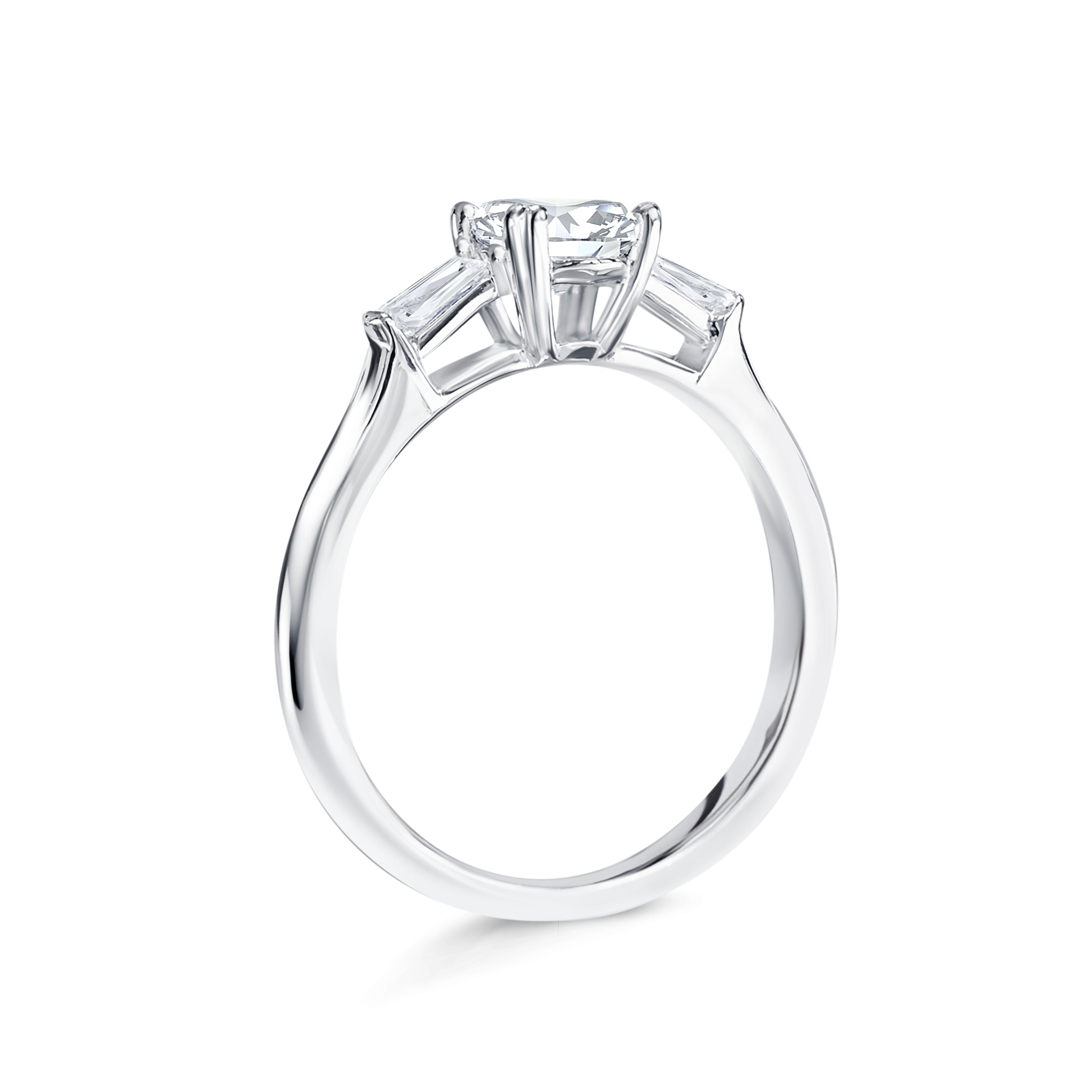 Audrey - Micheli Jewellery. side profile of engagement ring. trilogy engagement ring. diamond engagement ring on the side. baguette diamond engagement ring. white gold oval engagement ring. engagement ring with floating setting.