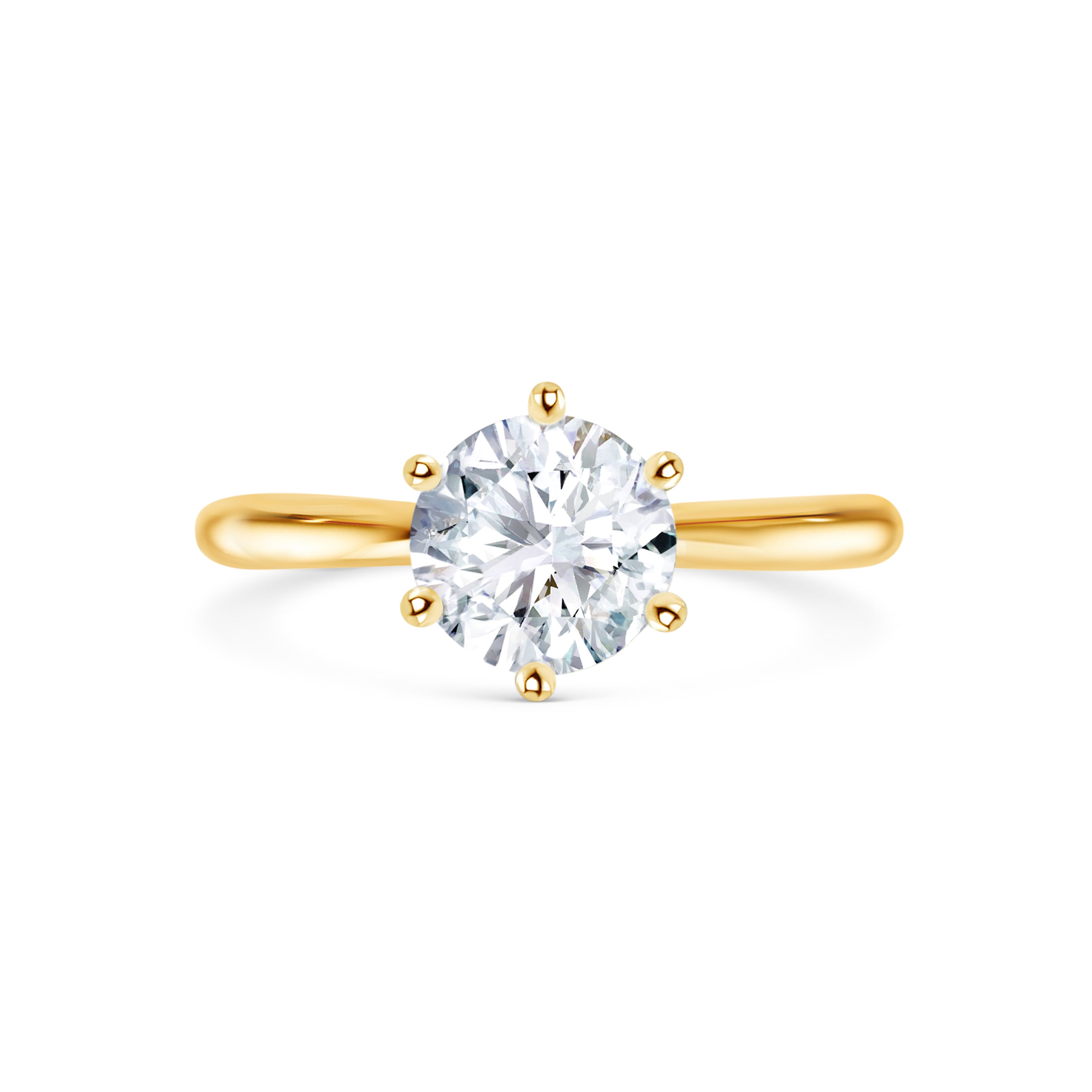 Beautiful round brilliant diamond engagement ring with yellow gold in six claw setting. Melbourne, Australia. Round brilliant cut diamond engagement ring with 6 claw setting in yellow gold. Gold band on engagement ring. Solitaire engagement ring.