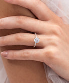 Rose - Micheli Jewellery, Diamond Engagement Ring, Rose Gold Engagement Ring with Round Brilliant Cut Centre Stone with 4 flaws and a Diamond Pave Band on hand. Diamond Engagement Ring modelled on hand. Rose gold Engagement Ring. Rose gold engagement ring on hand.