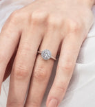 Anetta - Micheli Jewellery, diamond halo round brilliant cut diamond engagement ring in white gold. white gold engagement ring. diamond engagement ring modelled on the hand. diamond ring engagement ring staged on hand.