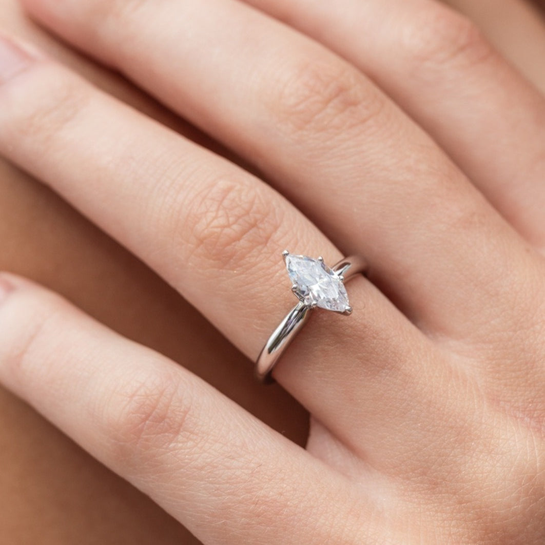 Martha - Micheli Jewellery, marquise diamond solitaire engagement ring in white gold. 6 claw engagement ring. white gold engagement ring. marquise diamond engagement ring modelled on hand. engagement ring on the hand.