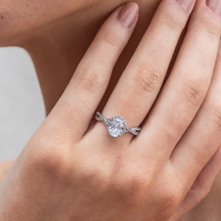 Larsa - Micheli Jewellery, engagement ring on hand. diamond engagement ring on hand. engagement ring modelled on hand. oval cut diamond engagement ring on hand. twisted diamond band engagement ring on hand.