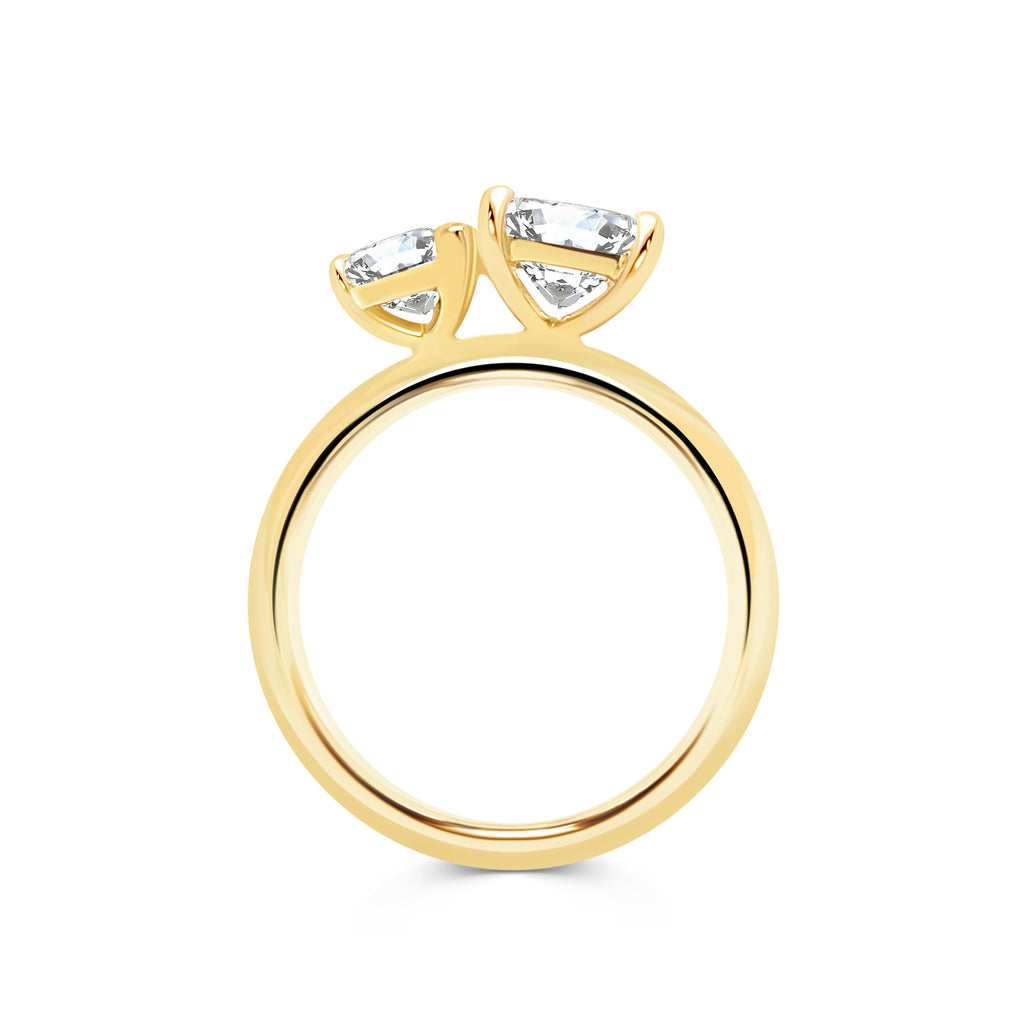 Toi et Moi ring with a Pear shaped & princess shaped diamonds in yellow gold band
