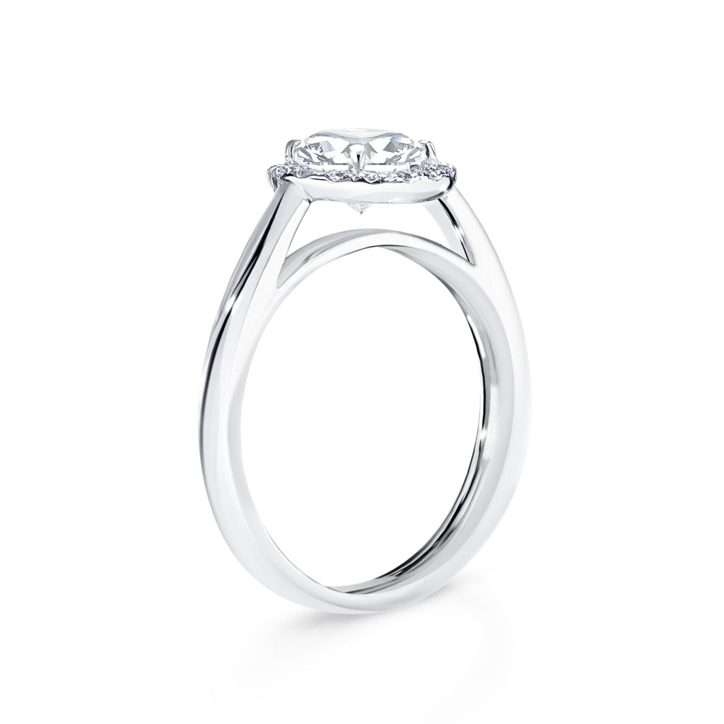 Anetta - Micheli Jewellery, floating setting on round brilliant cut diamond engagement ring side profile. swept up shoulders on engagement ring. diamond halo engagement ring side profile. white gold diamond engagement ring on the side. 