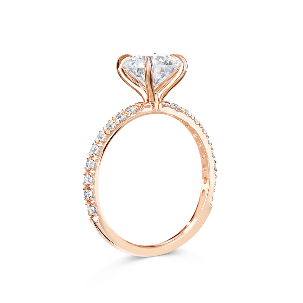 Rose - Micheli Jewellery, Rose Gold Round Brilliant Cut Diamond Engagement Ring with 4 claw setting and pave Diamond band. Upright photo of diamond engagement ring. Ring profile. Rose gold engagement ring.