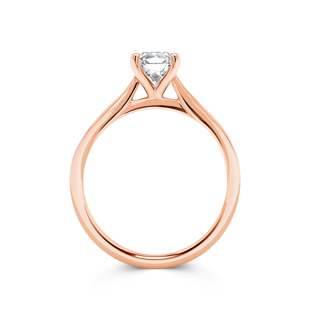Viola - Micheli Jewellery. Rose gold solitaire engagement ring with swept up shoulders and 4 claw setting. Solitaire round brilliant cut side profile. Rose gold engagement ring side view. Melbourne, Australia. 
