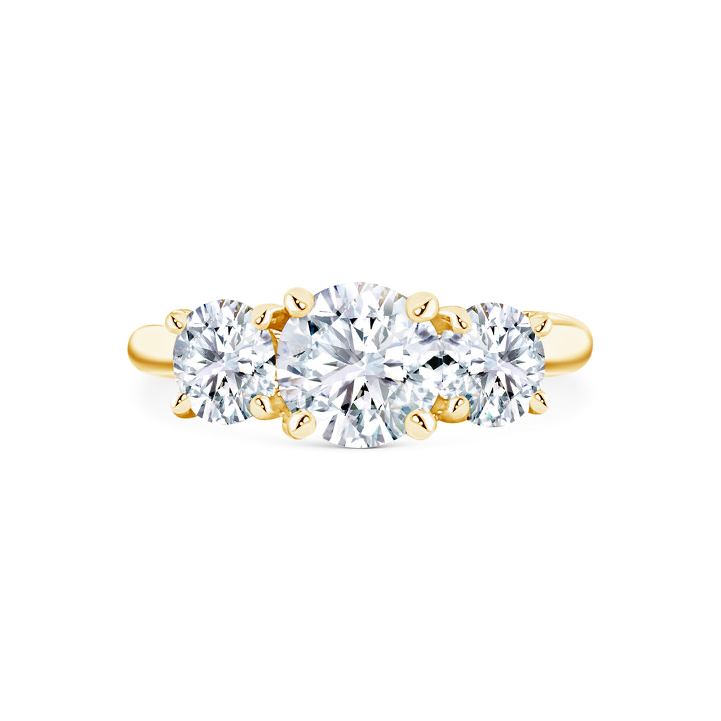 Micheli Jewellery's Trilogy engagement ring with 3 stones of round brilliant cut diamonds available in white or yellow gold