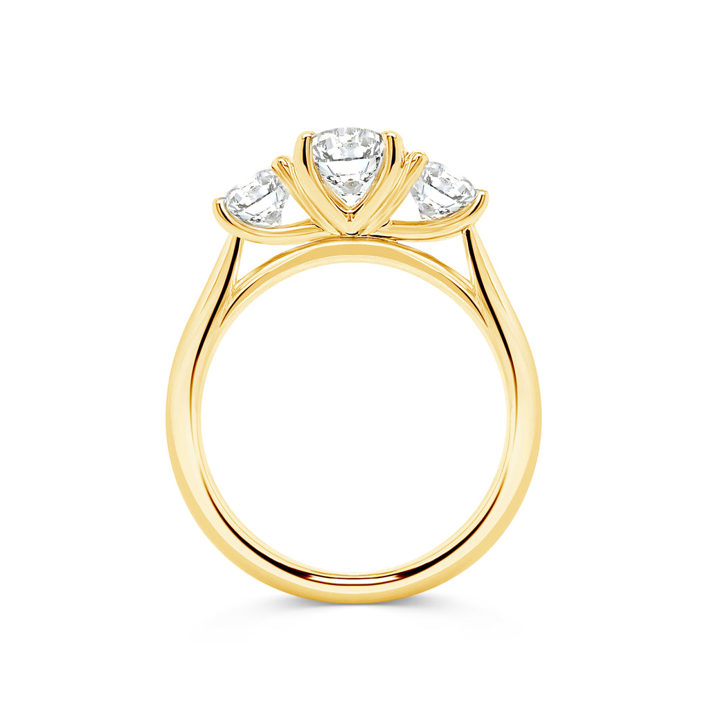 Micheli Jewellery's Trilogy engagement ring with 3 stones of round brilliant cut diamonds available in white or yellow gold