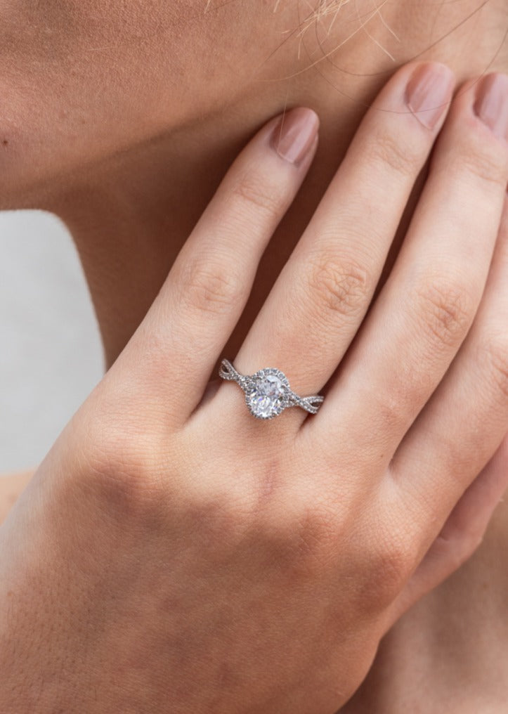 Larsa - Micheli Jewellery, engagement ring on hand. diamond engagement ring on hand. engagement ring modelled on hand. oval cut diamond engagement ring on hand. twisted diamond band engagement ring on hand. 